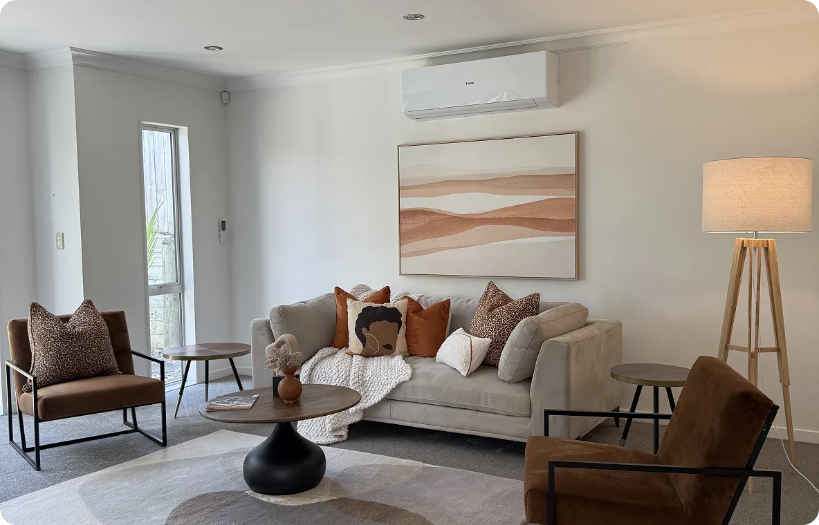 Stylish living room showcasing modern decor, cozy seating, and warm tones, highlighting our interior design services.