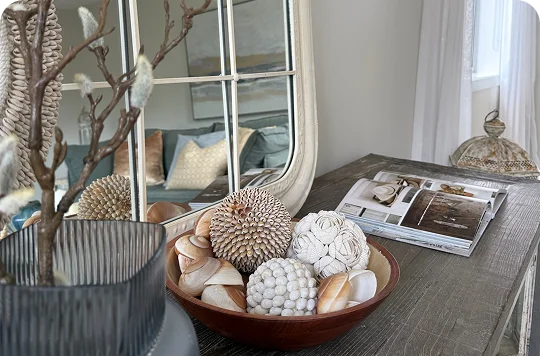 STAGY home staging Auckland: Decorative bowl with shells & spheres on rustic table