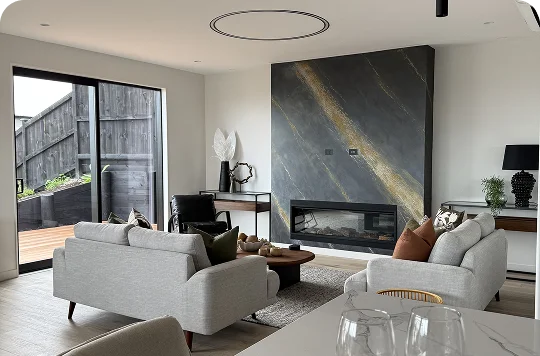 STAGY home staging in Auckland: modern living room with fireplace, sofas.